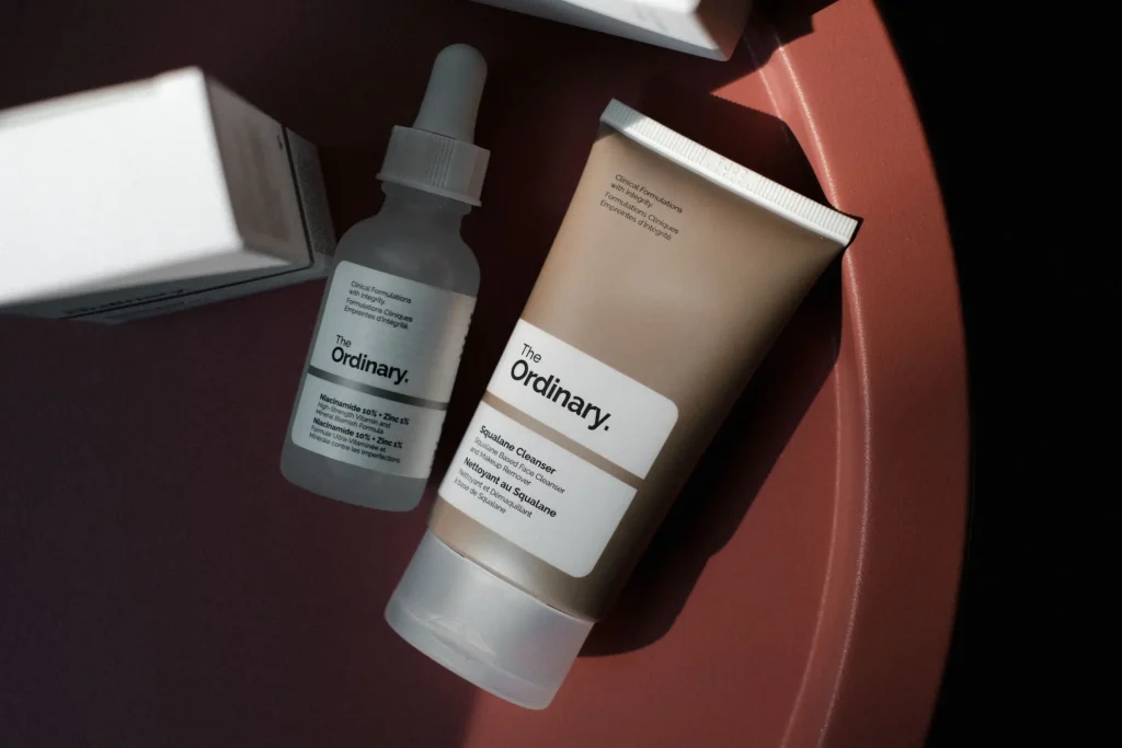 Top rated skincare products for acne-prone skin including cleanser, niacinamide serum, lightweight moisturizer, and sunscreen for a complete daily skincare routine.