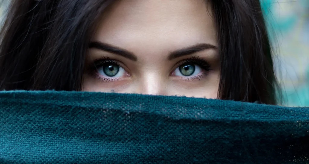 Woman with acne-prone skin following a gentle skincare routine