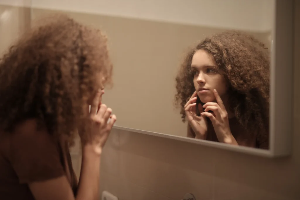 Woman following an anti-aging skincare routine for healthier-looking skin