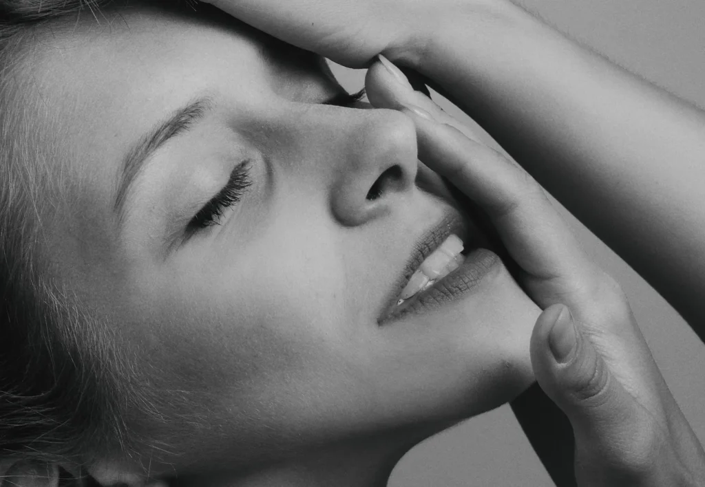 Woman following an anti-aging skincare routine for healthier-looking skin