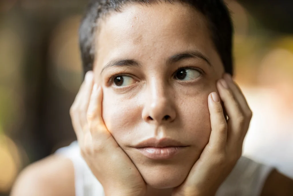 Woman moisturizing dry skin to improve hydration and skin barrier