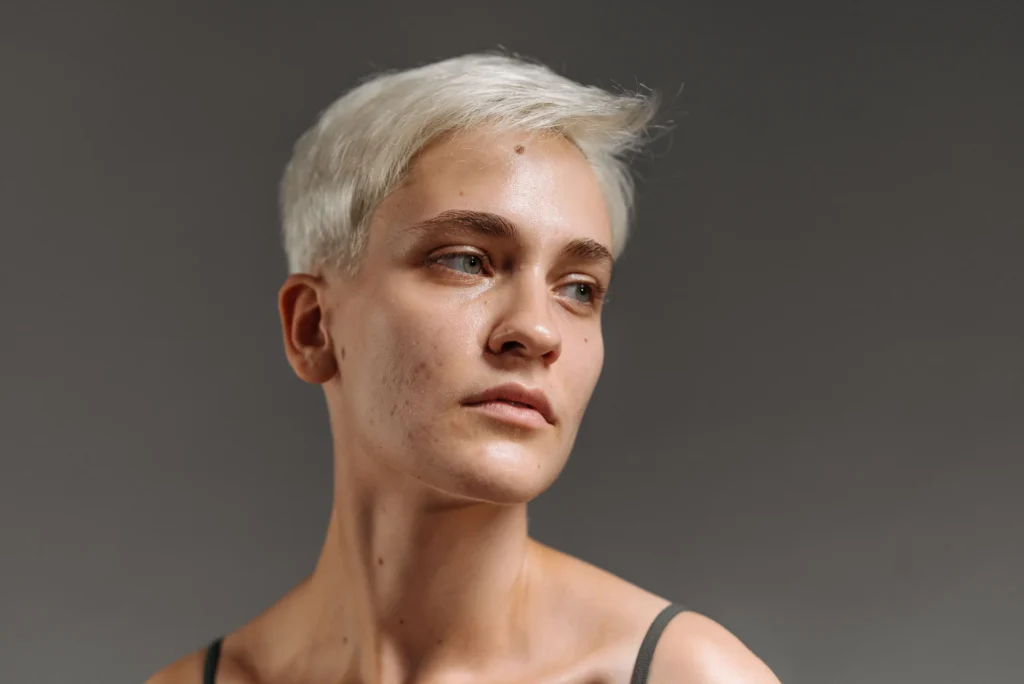 Woman with combination skin balancing an oily T-zone and dry cheeks