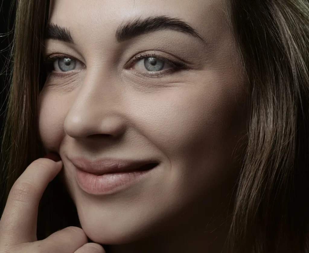 Woman moisturizing dry skin to improve hydration and skin barrier