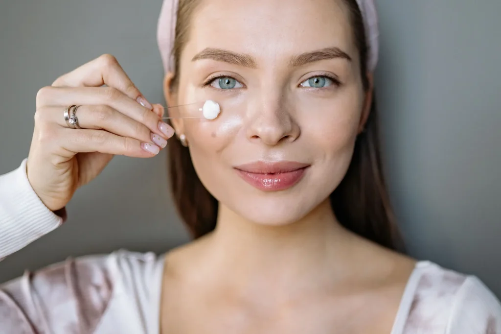 Person following a sensitive skin care guide using gentle skincare products to soothe and protect the skin barrier