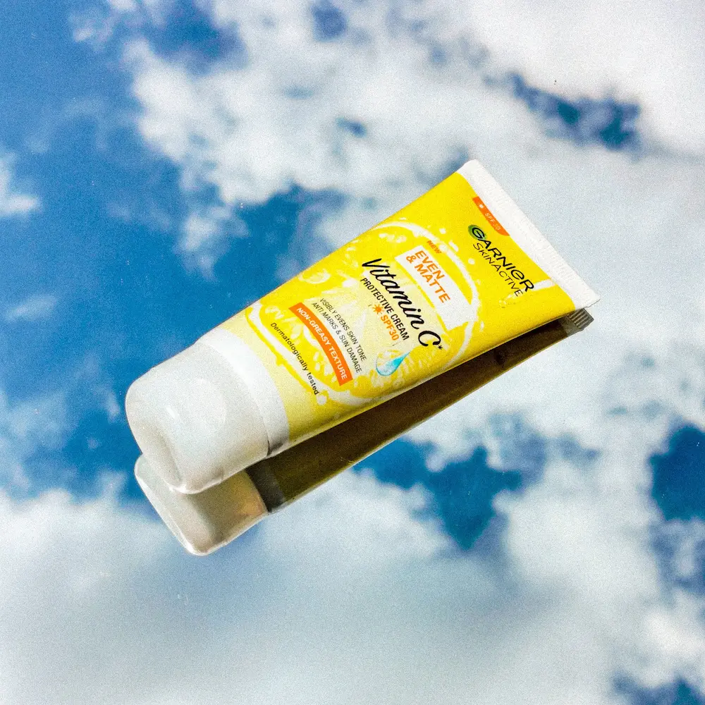 Applying sunscreen evenly to the face and neck