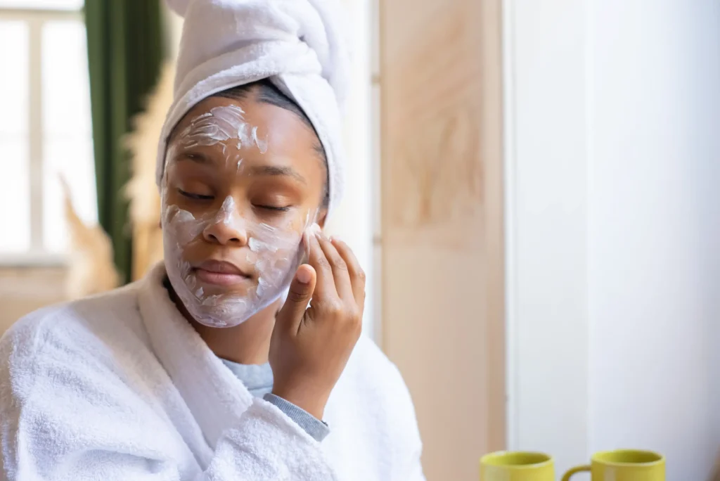 Woman applying a ceramide moisturizer to strengthen the skin barrier and improve healthy skin