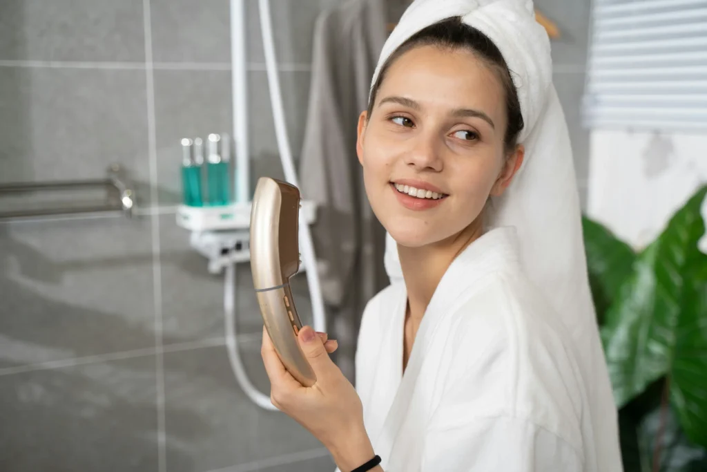 Woman exfoliating her face as part of a healthy skincare routine for every skin type
