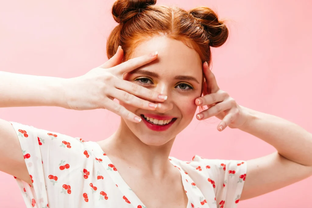 Woman exfoliating her face as part of a healthy skincare routine for every skin type