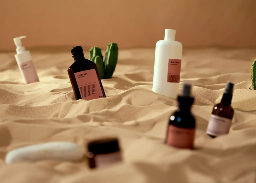 Beginner skincare routine featuring cleanser, moisturizer, sunscreen, and serum arranged on a clean bathroom counter.